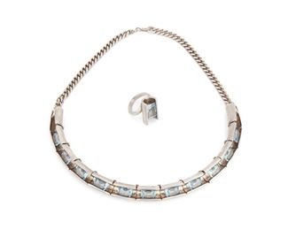 154
A Set Of Antonio Pineda Silver And Simulated Aquamarine Jewelry
1953-1979; Taxco, Mexico
Each stamped with crown mark for Antonio Pineda; Further stamped: Mota Tasco / 970 / [Eagle 3]; Necklace further stamped: Hecho en Mexico
Comprising a necklace with concave silver tube hinged segments centering faceted rectangular-cut simulated aquamarine suspended from chain terminals (15.5" L x 0.375"H) and a matching ring (ring size: 4.75)

2 pieces
109.5 grams gross
Estimate: $1,000 - $1,500