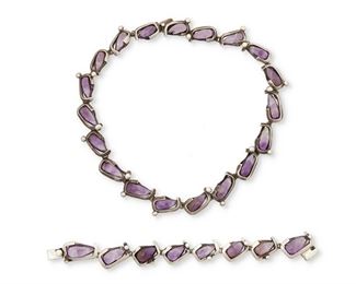 173
A Set Of Antonio Pineda Silver And Amethyst Jewelry
1953-1979; Taxco, Mexico
Each stamped with crown mark for Antonio Pineda; Each variously stamped: Sterling / Mexico / Silver / 970 / Hecho en Mexico / [Eagle 17]
Comprising a link necklace and matching bracelet, each designed with teardrop amethysts wrapped in geometric silver frames, and each with a clasp closure

2 pieces
Necklace: 17" L x 0.5" H; Bracelet: 7.25" L x 0.5" H
114.0 grams
Estimate: $1,000 - $1,500