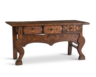 181
A Guatemalan Nahualá Carved Wood Altar Table
Circa 1940s; Guatemala
The carved wood altar table with rectangular top over three short drawers and raised on curved legs, decorated with star and avian motifs
24" H x 49.75" W x 18.5" D
Estimate: $800 - $1,200