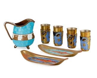 195
A Group Of Salvador Terán Mosaic And Brass Table Items
Third-Quarter 20th Century
Each marked: Handwrought / Salvador / Hecho en Mexico
Each with polychrome glass mosaic on brass depicting figural motifs, comprising a water pitcher (7.25" H x 8.5" W x 5.5" D), four tumblers (each: 5.125" H x 3" Dia. approximately), and two small trays (each: 1.75" H x 13.25" W x 5.75" D), 7 pieces
Estimate: $300 - $500