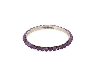 197
An Antonio Pineda Silver And Amethyst Bracelet
1953-1979; Taxco, Mexico
Crown mark for Antonio Pineda; Further stamped: 970 / JVL Taxco / [indistinct eagle]
A thin concave amethyst bead eternity bangle
8" total inner C x 0.25" W
24.2 grams
Estimate: $500 - $700