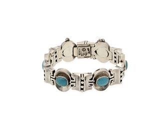 209
An Antonio Pineda Silver And Turquoise Bracelet
1953-1979; Taxco, Mexico
Stamped with crown for Antonio Pineda; Further stamped: Hecho en Mexico / 970 / Silver / [Eagle 17]
Designed with chunky geometric silver links set with oval cabochon turquoise stones
6.75" L x 0.75" H
95.2 grams
Estimate: $800 - $1,200