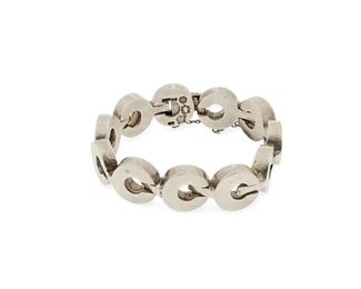 208
An Antonio Pineda Silver Link Bracelet
1953-1980; Taxco, Mexico
Stamped with crown for Antonio Pineda; Further stamped: Taxco / JVL / Sterling / [Eagle 208] / 925
A heavy silver bracelet with "C" shaped links and clasp closure with chain guard
8" L x 0.75" H
120.2 grams
Estimate: $600 - $800