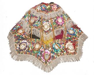 210
A Mexican Ceremonial Dance Cape
Circa 1960s; Mexico
Lining inscribed in red pen: M. B 7
For a conquistador dance, the cape with polychrome synthetic sequins, mirrored appliques, and fringe on purple and magenta velvet, with natural fiber fabric lining
33" L x 25.5" W approximately
Estimate: $300 - $500