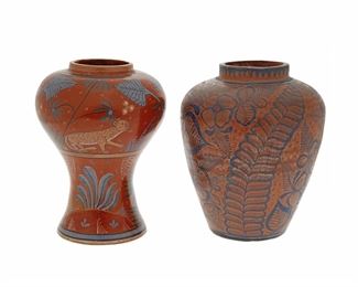 225
Two Tonalá Bruñido Vases
Circa 1920s; Tonalá, Mexico
Comprising an urn-form jar with cobalt blue floral motifs and stylized star pattern with a sawtooth band on red (8" H x 6.25" Dia.) and a jar with polychrome animal motifs stylized star pattern (11" H x 7" Dia.), 2 pieces
Estimate: $300 - $500