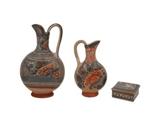 228
Three Tonalá Bruñido Pottery Items, By Amado Galvan
(1893-1954, Tonalá, Mexico)
Each signed
Comprising a large flat-sided pitcher with avian and sun motifs (15.5" H x 9.5" W x 4" D), a small flat-sided pitcher with a deer and floral motifs (11" H x 6.5"
W x 3.25" D), and a trinket box with a stork and floral motifs (2.25" H x 4.5" W x 4.75 D), 3 pieces
Estimate: $400 - $600