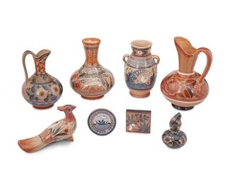 229
A Group Of Tonalá Pottery Items
Eight works:

A large orange pitcher with avian motifs
Circa 1970s; Tonalá, Mexico
Signed: J.P. / Mexico
12.5" H x 8" Dia.

A small pitcher with daisies
Circa 1970s; Tonalá, Mexico
10.75" H x 7" Dia.

A water jar with deer motifs
Circa 1970s; Tonalá, Mexico
Marked: Tonala Jal
10.5" H x 8" Dia.

A two-handled vase with avian motifs
Circa 1970s; Tonalá, Mexico
10.25" H x 6.5" W x 6" D

A peacock figure
Circa 1970s; Tonalá, Mexico
Marked: Mexico [illegible]
5.75" H x 3.5" W x 9.25" D

A small gourd vase, by Pablo Jimón
Circa 1950s; Tonalá, Mexico
Signed: Pablo Jimón
5.875" H x 4" Dia.

A tile with campesino scene, by Angel Ortiz, Sr.
Circa 2000; Tonalá, Mexico
Signed: A. Ortiz Mexico
3.875" H x 4" W x 0.75" D

A small charger with white bird, by Florentino Jimón Barba
Circa 1990s; Tonalá, Mexico
Signed: Jimón / Mexico
4.625" Dia.

8 pieces
Estimate: $200 - $300