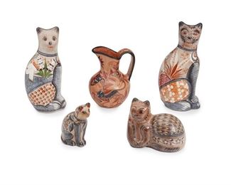 230
A Group Of Tonalá Pottery Items
Five works:

A cat figure with heavy whiskers, by Pablo Jimón
Circa 1960s; Tonalá, Mexico
14" H x 6.5" W x 5.25" D

A cat figure with campesino, by Antonio Solis
Circa I980s; Tonalá, Mexico
Signed: A. Solis / Mexico
13.5" H x 6" W x 5.25" D

A pitcher with a nahual, by Angel Ortiz, Sr.
Circa 2005; Tonalá, Mexico
Signed: A. Ortiz / Mexico
9.5" H x 7.5" W x 6.5" D

A recumbent cat figure
Circa I970s; Tonalá, Mexico
6.5" H x 8" W x4.75" D

A small seated cat figure, by Antonio Solis
Circa I960s; Tonalá, Mexico
Signed: Solis / Mexico
6.25" H x 3" W x 5" D

5 pieces
Estimate: $400 - $600
