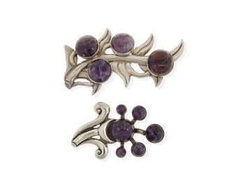 236
Two Antonio Pineda Amethyst And Silver Floral Brooches
1948-1953; Taxco, Mexico
Each stamped: Silver by Tono / Mexico
Comprising two silver floral motif brooches with cabochon set amethysts, one with leaves and long stem (2.5" H x 4.25" W) and one as a flower sprig (2" H x 3.25" W)

2 pieces
108.7 grams gross
Estimate: $600 - $800