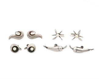 237
A Group Of Antonio Pineda Sterling Silver And Gemstone Earrings
1948-1953 and 1953-1979; Taxco, Mexico
Four works:

A pair of silver and pearl starburst/claw screw-back earrings
Attributed to Antonio Pineda; Further stamped: [Eagle 17] / Hecho en Mexico / [Eagle 58] / 970
0.75" L

A pair of silver and pearl earrings
Marked for Antonio Pineda; Further stamped: [crown] / 970 / [Eagle 17]
0.5" L

A pair of silver screw-back flower-bud earrings
1948-1953
Marked for Antonio Pineda; Further stamped: Silver by Tono / [Eagle 17] / Made in Mexico
1.5" L

A pair of moonstone and silver paisley screw-back earrings
Marked for Antonio Pineda; Further stamped: [crown] / Sterling / Mexico / 970
1.125" L

8 pieces
45 grams gross
Estimate: $400 - $600