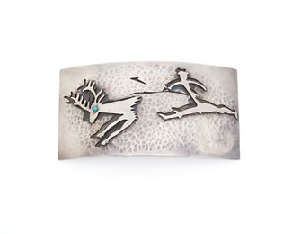 248
An Antonio Pineda Lascaux-Motif Sterling Silver Belt Buckle And Belt
1953-1979; Taxco, Mexico
Crown mark for Antonio Pineda; Further stamped: [Eagle 17] / Hecho en Mexico / Silver / 970 / PZ105
A large rectangular belt buckle featuring a Lascaux-inspired hunting scene detailed with a single small cabochon turquoise eye, all on a detachable black suede belt

2 pieces
Buckle: 2.75" H x 5.75" W
231.2 grams gross
Estimate: $500 - $700