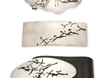 249
A Group Of Antonio Pineda Lascaux-Motif Silver Belt Buckles
1953-1979; Taxco, Mexico
Each with crown mark for Antonio Pineda; Further stamped: Silver / 970 / Hecho en Mexico / [Eagle 17]
Comprising three Lascaux-inspired belt buckles, consisting of a large oval buckle with detachable black leather belt PZ148 (2.5" H x 5.875"W, belt: 32" L); a large rectangular buckle PZ164 (2.25" H x 5.75" W); and an abstract plaque buckle with silver overlay figures and copper inlay accents PZ149 (2.25" H x 5.5" W)

4 pieces
560.5 grams gross
Estimate: $600 - $800