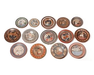 254
A Large Group Of Tonalá Pottery Chargers
Twelve groupings:

Three Florentino Jimón Barba chargers
Circa 2000; Tonalá, Mexico
Two signed: Jimon / Mexico
One with one white bird and a yellow border (8.25" Dia.), one with three birds (12" Dia.), and one with two deer (12.25" Dia.), 3 pieces

Charger with a sleeping campesino, by Basulto
Circa 1960s; Tonalá, Mexico
Signed: Basulto / Tonala / Jal
9.375" Dia.

Charger with a stork, by Simeon Galvan
Circa 1950s; Tonalá, Mexico
Signed: S.G. / Mexico
10.125" Dia.

Charger with a crane, by Antonio Solis
Circa 1960s; Tonalá, Mexico
Signed: A. Solis / Mexico
10" Dia.

Charger with a prone deer
Circa 1970s; Tonalá, Mexico
11.75" Dia.

Charger with an upside down crane
Circa 1970s; Tonalá, Mexico
12.5" Dia.

Charger with a seated campesino
Circa 1970s; Tonalá, Mexico
Marked: Mexico
12" Dia.

Charger with two blossoms and four leaves
Circa 1960s; Tonalá, Mexico
11.625" Dia.

Charger with Mexican national seal, by Angel Ortiz, Sr.
Circa 2000; Tona