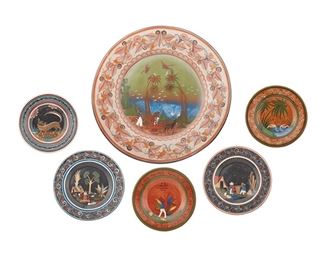 256
A Group Of Tonalá Pottery Chargers, By Angel Ortiz, Sr.
20th/21st Century; Tonalá, Mexico
Each signed: A. Ortiz / Mexico / Tonala
Each pottery charger decorated with polychrome figural and floral motifs, comprising one with a campesino harvesting mescal (10.375" Dia.), one with two cranes (10.25" Dia.), one with two campesinos (11.5" Dia.), one with a nahual (10.375" Dia.), one with a campesina carrying water (11.625" Dia.), and a large charger with campesinos and a burro (25.25" Dia.), 6 pieces
Estimate: $300 - $500