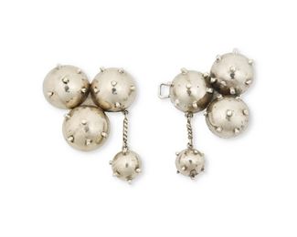 263
A Hubert Harmon Silver Belt Buckle
1944-1948; Mexico
Marked with winged feet for Hubert Harmon; Further stamped: Hubert Harmon / Made in Mexico / Sterling
A whimsical "Sputnik" motif belt buckle

2 pieces
4.5" W x 3" H
102.0 grams
Estimate: $200 - $400