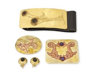 268
A Group Of Hubert Harmon Brass And Copper Buckles And Cuff Links
Four works:

A brass buckle with an applied copper repoussé double fish motif set with amethysts
1942-1948; Mexico
Stamped: Hubert Harmon / Mexico
3.25" H x 4.25" W

An oval brass buckle with an applied copper repoussé fish motif with amethyst eye
1942-1948; Mexico
Appears unmarked
2.5" H x 3.5" W

A larger brass belt buckle with two repoussé aquatic creatures set with black stone eyes on a wide leather detachable belt
1942-1948; Mexico
Stamped: Hubert Harmon / Made in Mexico
Buckle: 3" H x 6.625" W; belt: 24.75" (max.) x 2.875" H

A pair of matching round brass cuff links each with central black stone
1942-1948; Mexico
Each stamped: Hubert Harmon / Made in Mexico
1.125" Dia.

6 pieces
333.4 grams gross
Estimate: $300 - $500
