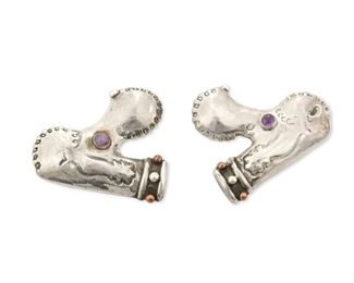 270
Two Hubert Harmon Silver And Amethyst Poodle Brooches
1944-48; Mexico
Each stamped with winged feet for Hubert Harmon; Further stamped: Hubert Harmon / Sterling / Made in Mexico
Each poodle brooch made in silver with copper studs to collars and amethyst eyes, one with loop to front, and able to be worn together with opposing faces

2 pieces
Each: 1.75" H x 1.5" W
26.2 grams gross
Estimate: $400 - $600