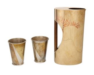 274
A Group Of Mexican Mixed-Metal Table Items
Five works:

A Los Castillo mixed-metal and sterling silver cigarette case
Third-Quarter 20th Century; Taxco, Mexico
Marked: Sterling / Los Castillo / Taxco / [Eagle 15]
The lidded cigarette case with "MRA" to the front
3.625" H x 2.375" W x 1.25" D
4.39 gross oz. troy approximately

A Los Castillo mixed-metal footed tray
Third-Quarter 20th Century; Taxco, Mexico
Marked: Los Castillo / Taxco / Hecho en Mexico / Handwrought / 240
With scalloped sides
1.375" H x 11.25" W x 9.125" D

A Los Castillo mixed-metal footed tray
Third-Quarter 20th Century; Taxco, Mexico
Marked: Los Castillo / Taxco / Hecho a Mano / 95
In a tear drop form
1.125" H x 10.5" W x 5.5" D

A mixed-metal oval tray
Third-Quarter 20th Century
Unmarked
0.125" H x 7.375" W x 5.75" D

A Metales Casados mixed-metal humidor box
Third-Quarter 20th Century
Marked: E2 / Handwrought / Metales Casados
The humidor box with hinged lid and wood interior
2" H x 7.75" W x 4.375" D

5 pieces