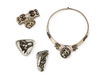 281
A Group Of Salvador Terán Silver Jewelry
Third-Quarter 20th Century; Mexico City, Mexico
Each stamped: Salvador [script] / Sterling / Mexico / Eagle 36; further variously stamped with design number
Comprised of a hinged collar necklace with bone inlaid hinges and detachable central inlaid figurative pendant/brooch No. 518 (14" L x 1.5" H), a matching inlaid hinged bracelet with pendant no. 518 (6.25" L x 2" H); and two figurative warrior brooches set to hammered plaques, one triangular shaped No. 507 (2" H x 2.25" W) and one rectangular no. 504 (2.5" H x 1.25" W)

5 pieces
189.2 grams gross
Estimate: $600 - $900