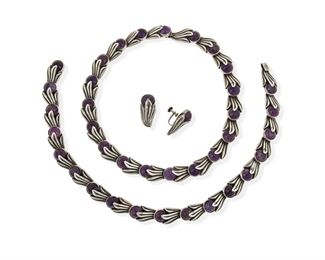 282
A Set Of Los Castillo Silver And Amethyst Jewelry
1940-1965; Taxco, Mexico
Each necklace stamped: Los Castillo / Taxco / Sterling / 468 / [Mexico or Made in Mexico]
Comprising two necklaces set with amethyst cabochons, which can be joined together (16.5" L x 0.5" H and 15.25" L x 0.5" H), and a pair of screw-back earrings (1.125" L x 0.5" W)

4 pieces
160.9 grams gross
Estimate: $800 - $1,200