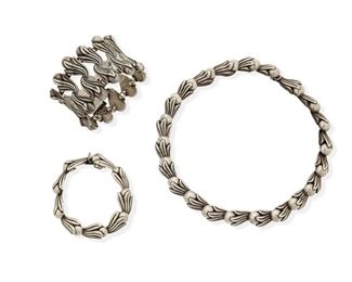 287
A Group Of Los Castillo Silver Jewelry
1939-1945 and 1945-1960; Taxco, Mexico
Each stamped: Los Castillo / Taxco / 468; Further variously stamped: Made in Mexico / Sterling / [Eagle 15] / 925
Comprising a necklace with silver cabochons (17" L x 0.5" H), a double width bracelet (6.75" L x 1.875" H), and a smaller single width bracelet (6.5" L x 2" H)

3 pieces
216.1 grams gross
Estimate: $600 - $800