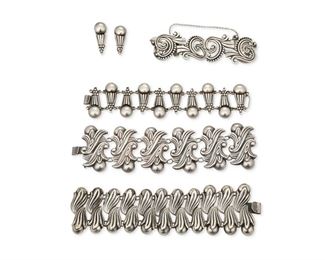 293
A Group Of Los Castillo Silver Bracelets
1939-1945 and 1945-1960; Taxco, Mexico
Each stamped: Los Castillo / Taxco / Sterling / Mexico; Further variously stamped: [Eagle 15]
Comprising an alternating, double width silver bud bracelet (7" L x 2" H); an alternating, double floral spray bracelet No. 116 (7" L x 2" H); an alternating cone and ball link bracelet No. 626 (6.5" L x 1.5" H) with matching earrings Nos. 626 and 622 (each: 1.375" L); and a swirl and dot link bracelet No. 615 (6.5" L x 1.125" H)

6 pieces
264.0 grams gross
Estimate: $600 - $800