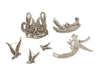 297
A Group Of Los Castillo Silver Avian Brooches
1940-1945, Taxco, Mexico
Each stamped: Los Castillo / Taxco / Sterling / Made in Mexico; Further variously stamped with design number
Comprising a double swan brooch/pendant No. 516 (2.75" H x 3" W), a brooch of a long-tailed bird eating fruit No. 642 (4" H x 2.5" W), a parrot brooch No. 525 (3" H x 1.75" W), and three brooches of a bird in flight in graduated sizes No. 622, 622-2, 622-3; (2" H to 1" H)

6 pieces
109.1 grams gross
Estimate: $200 - $300