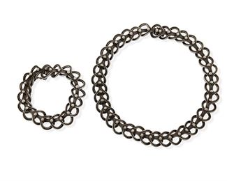 310
A Set Of Margot De Taxco Silver Jewelry
1948-1978; Taxco, Mexico
Each stamped: Margot de Taxco / Sterling / Made in Mexico / [Eagle 16] / 5307
Designed by Margot Van Voorhies, comprising an openwork articulated round link necklace with matching bracelet No. 5307

2 pieces
Necklace: 16.5" L x 0.75" H; Bracelet: 8" L x 0.75" H
180.0 grams
Estimate: $500 - $700