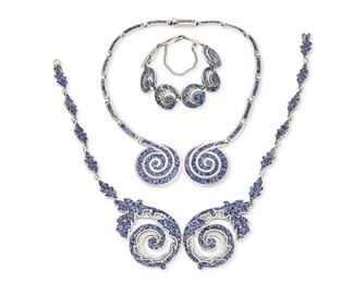 311
A Group Of Margot De Taxco Silver And Enamel Jewelry
1955-1978; Taxco, Mexico
Each stamped: Margot de Taxco / Sterling / Made in Mexico / [Eagle 16]; each further stamped with design number
Designed by Margot Van Voorhies, comprising a blue stylized foliate design bib necklace with link chain No. 5384 (16.25" L x 2.25" H) with matching link bracelet (7" L x 0.875" H) and a blue spiral design bib necklace with link chain No. 5357 (16" L x 1.5" H)

3 pieces
166.8 grams gross
Estimate: $600 - $800