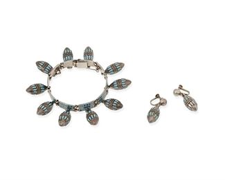 312
A Set Of Margot De Taxco "Fanciful Pendants" Jewelry
1948-1978; Taxco, Mexico
Each stamped: Margot de Taxco / Sterling / Made in Mexico / [Eagle 16]; Bracelet further stamped: 5701
Designed by Margot Van Voorhies, comprising a link bracelet and matching clip earrings with turquoise enamel on silver drops

3 pieces
Bracelet: 7.5" L x 1.5" H; Each earring: 1.375" L
65.0 grams gross
Estimate: $400 - $600