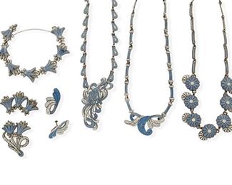 316
A Large Group Of Margot De Taxco Silver And Enamel Jewelry
1953-1978; Taxco, Mexico
Each stamped: Margot de Taxco / Sterling / Made in Mexico / [Eagle 16]; Each further stamped with design number
Designed by Margot Van Voorhies, featuring blue and white enamel floral motifs, comprising a suite of "Hanging Flowers" jewelry No. 5837 & 5837A, consisting of a bracelet (7.5" L x 0.75" H ) and two brooches (1.5" and 1.25" H x 2" W); a blue and white flower necklace No. 5669 (17.25" L x 0.875" H); a pendant/brooch with two detachable enamel link chains No. 5734 (17.5" L x 1" H) with matching ear clips (1.5" L); and a pendant/brooch with two detachable link chains No. 5683 (16" L x 2.5" H)

12 pieces
244.5 grams gross
Estimate: $1,500 - $2,000