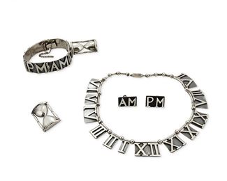 320
A Suite Of Margot De Taxco "AM-PM" Silver Jewelry
1948-1978; Taxco, Mexico
Each stamped: Margot de Taxco / Sterling / Made in Mexico / [Eagle 16]; Each further stamped with design number
Designed by Margot Van Voorhies, comprising a Roman numeral link necklace No. 5201 (15" L x 0.875" H) with matching AM-PM bracelet suspending an hourglass charm (7" L x 0.625" H) and a pair of matching ear clips (0.875" L), along with a similar design hourglass brooch No. 5126 (1.5" H)

5 pieces
143.0 grams
Estimate: $700 - $900
