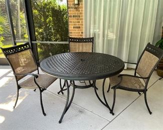 Patio table and 4 chairs (1 not shown)