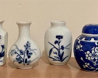 Item 40:  (4) Piece blue & white set (vases & ginger jar): $14                                                                                                         Tallest - 3"