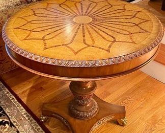 Item 94:  Hand Carved Pedestal Table with Cherry Apron and Claw Feet. The top is inlaid Maple, Cherry and Walnut in a Sunburst Pattern - 36"d x 30"h:  $475