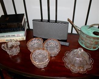 Antique pressed glass, Bose iPod dock, watering can