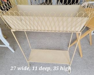 Metal flower planter on stand