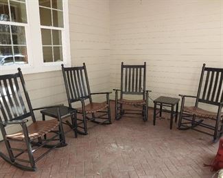4 Black porch rockers and 2 side tables