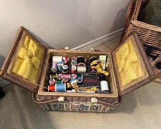 Sewing kit in vintage wicker top close basket