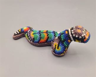Multi colored beaded snake figurine
