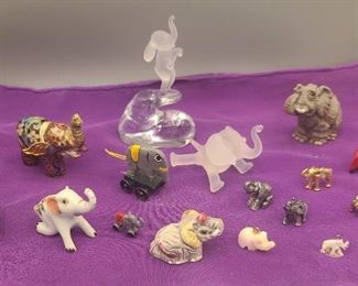 Variety of miniature elephant statues includes elephant pendants 