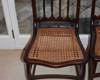 Set of six chairs with woven/rattan seats / great condition on all but one chair