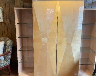 When closed this cabinet has glass shelves for displays