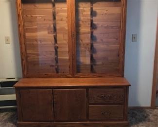 Rifle cabinet with locking mechanism inside 