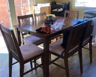 Table with 4 chairs and double bench