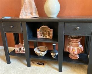Broyhill sofa table with collection of Mexican pottery