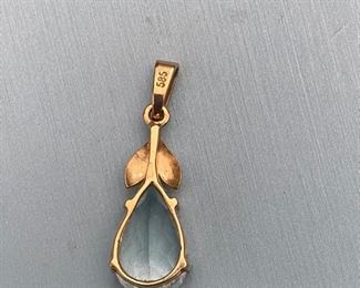 #32 - $75 - Blue topaz pear shaped pendant on 14kt yellow gold mount