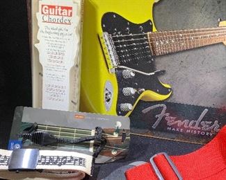 Guitar straps and Fender wall tin