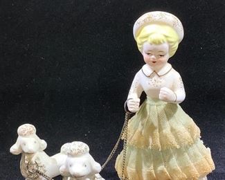 Vintage porcelain ceramic girl walking poodles