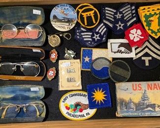 Vintage military patches and antique glasses